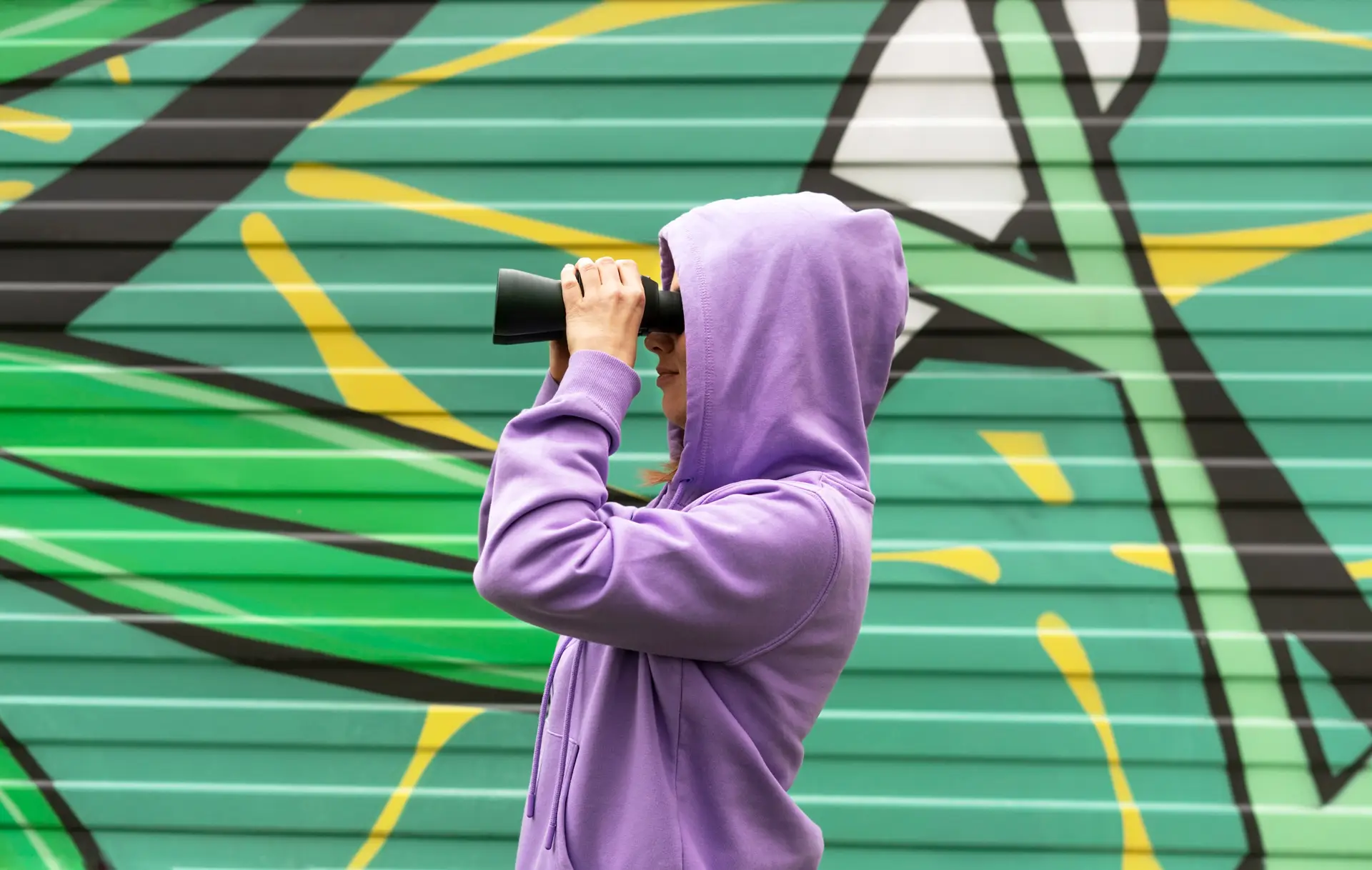 Woman looking at something with a binocular